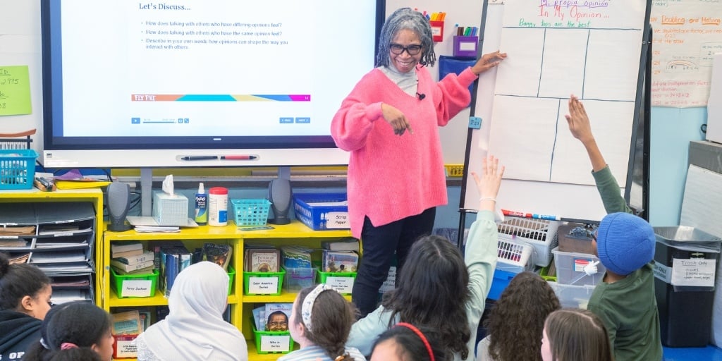 Teacher Ina leads her students